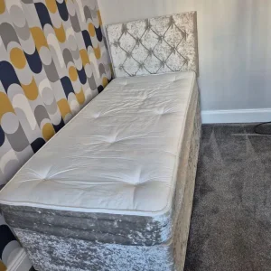 Single bed with mattress and headboard