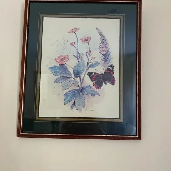 Mounted picture in dark wood frame