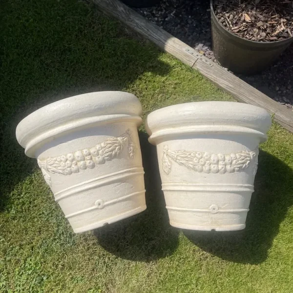 Pair of large ornate plastic planters