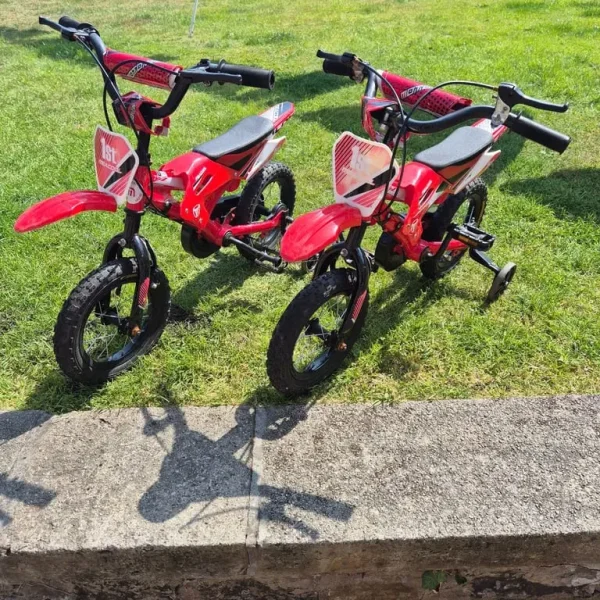 Two kids bikes with stabilisers