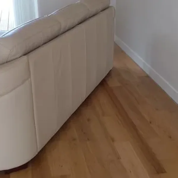 Cream leather sofa and armchair with stool