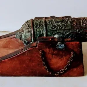 Small brass cannon on wood base