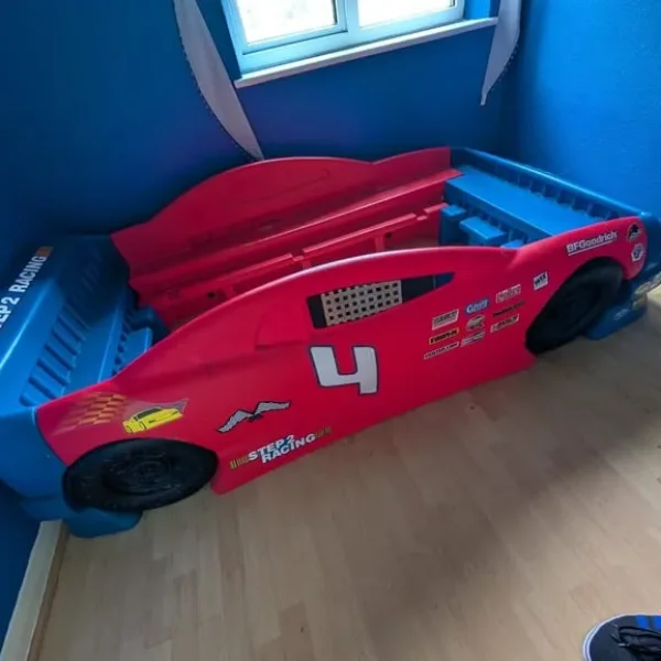 Red and blue childrens car bed