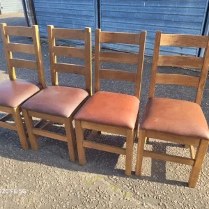 4 solid oak dining chairs with leather seats