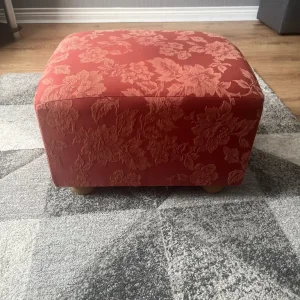 Red pouffe stool