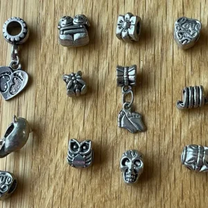 12 bracelet charms. Fit Pandora & troll