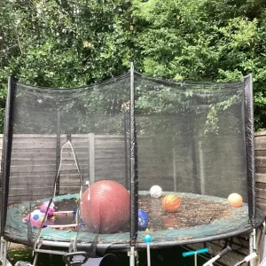 Large trampoline with secure frame
