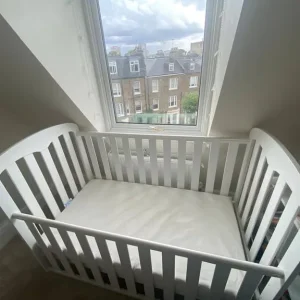 Wooden cot bed with mattress from John Lewis - Image 2