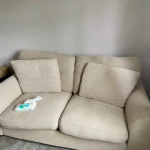 2-seater beige fabric sofa