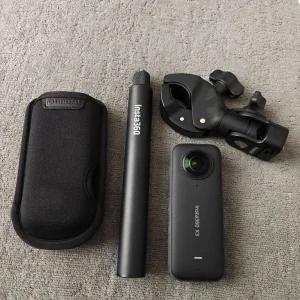 Insta 360 X3 4K action camera with selfie stick and bike mount