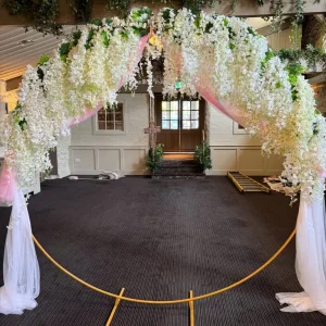 Wedding Arch with white wisteria and voile