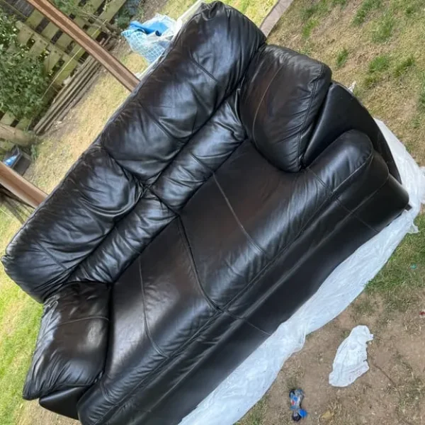 Black leather 2 seater sofa