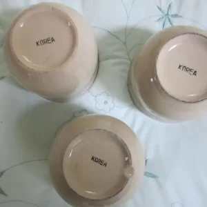Three Made in North Korea decorative round glazed bowls, 10cm height and diameter