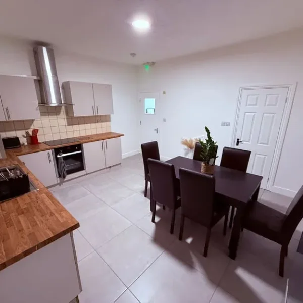 Ikea Black wooden dinning table plus 10 chairs