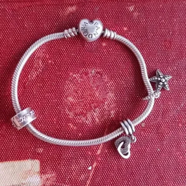 Pandora silver bracelet with 3 pieces