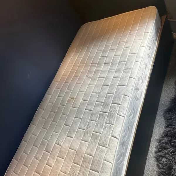 Black leather divan bed with headboard and mattress