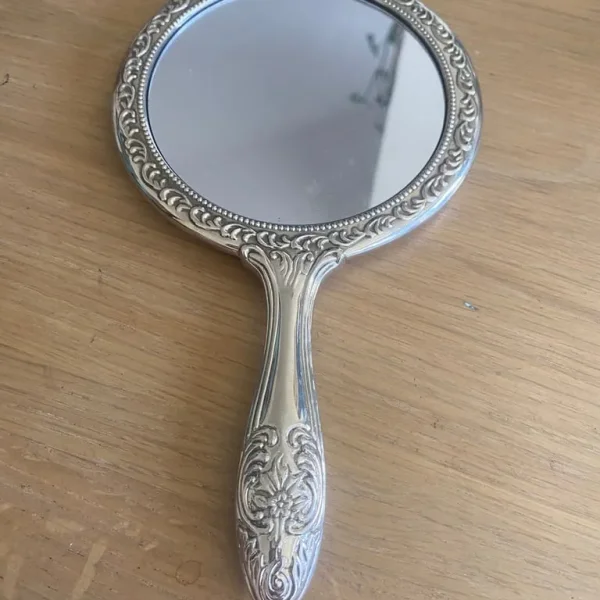 Antique silver plated hand mirror 9 x 5 inches very heavy