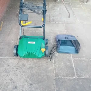 Lawn scarifier and rake