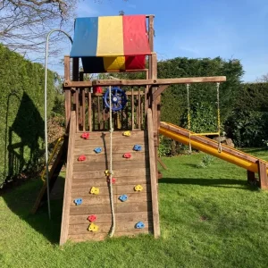 Wooden climbing frame with slide, swing and playhouse - Image 3