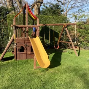 Wooden climbing frame with slide, swing and playhouse