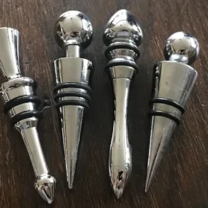 A Set Of Metal Bottle Stoppers, Silver Plated Corkscrew and Drip Ring - Image 2