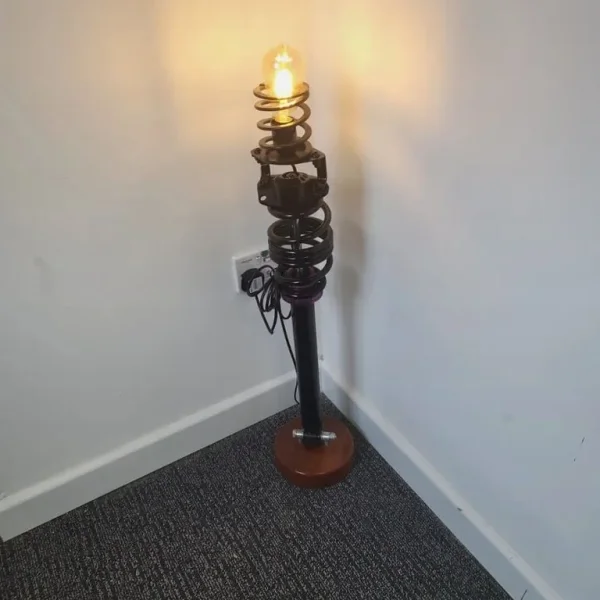 VW Golf MK6 Rear Stance Coil Over Fitted With A Vintage Lamp Mounted On A Mahogany Base