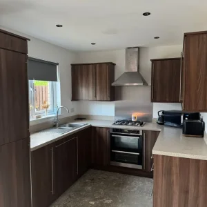Large kitchen with matching utility