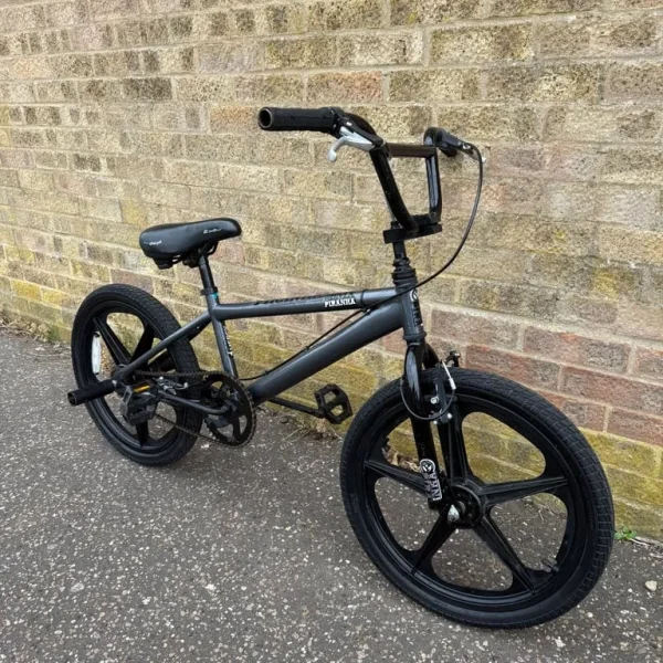 PIRANHA MERCY BMX IN GREY AND BLACK WITH MAT BALCK REAR STUNT PEGS
