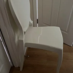 White thick plastic dressing table chair