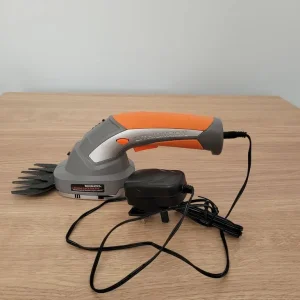 Hand held grass trimmer