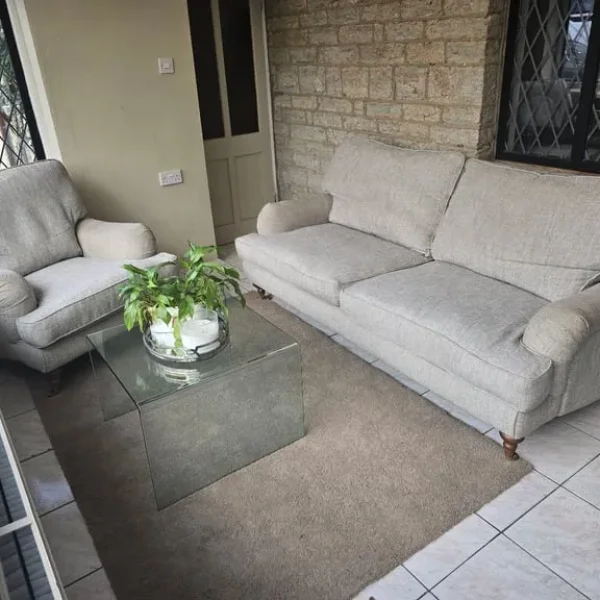 Harvey's sofa & Matching armchair both with front brass casters Howard Style. DELIVERY POSSIBLE