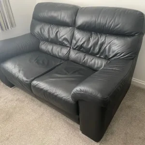 Black leather 2 seater sofa x2 with matching footstool - Image 2