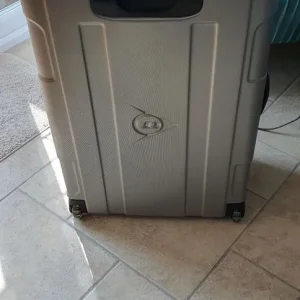 Large Dunlop hard shell suitcase.