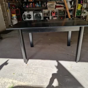 Black extending solid wood dining room table and 6 chairs