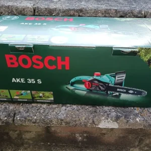 BOSCH CHAINSAW, Hardly Used, Box, Instructions, Pair of Safety Goggles & Oil