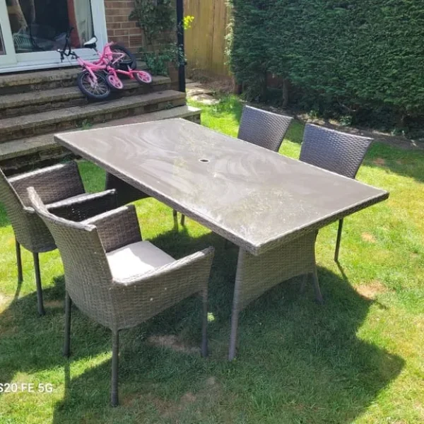 Rattan garden table with four chairs, delivery available