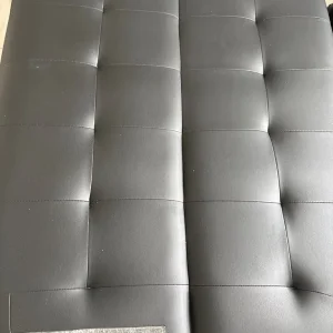 Black faux leather sofa bed