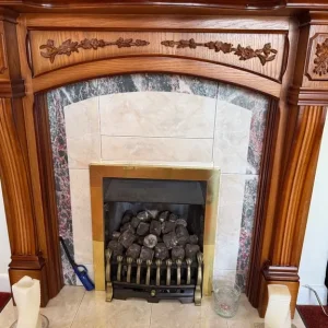 Kinder Gas fire with wooden surround and tiles