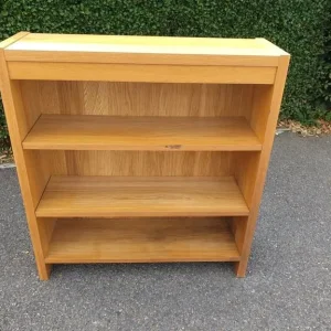 A heavy/sturdy light oak coloured bookcase/book/shelf unit,