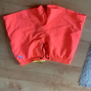Two pairs of well made shorts,unworn, med/large