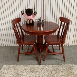 Round pedestal breakfast / bistro table with two chairs.