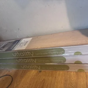 3x boxes of laminate flooring with roll of underlay