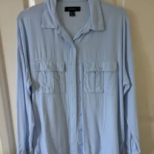 Light blue button-up shirt. Size 10. Atmosphere.