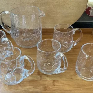Crackle glass jug and 5 tankards