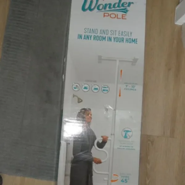 Stander security pole and curve grab bar