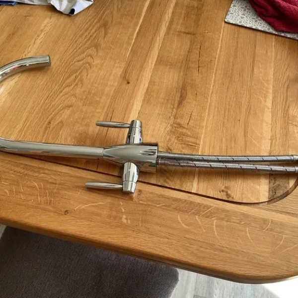 Kitchen mixer taps. Hot and cold levers with water connectors