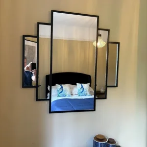 Black metal framed wall mirror, art deco style
