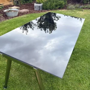 Glass desk with adjustable legs