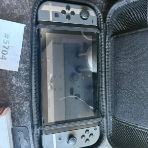 Nintendo Switch with new controllers and charger - Image 2