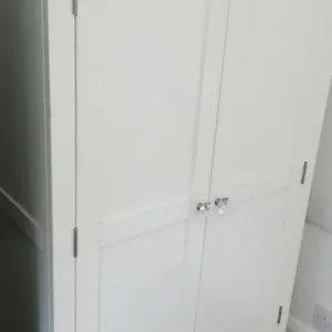 Double door white wood wardrobe with hanging rail - Image 4